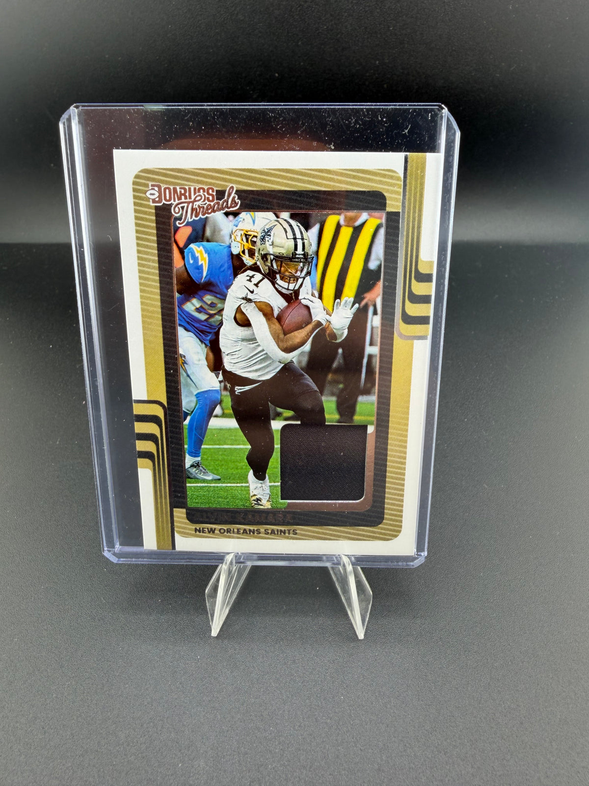 2025 Panini Donruss Threads Alvin Kamara Memorabilia Card #DTH-AKA - front