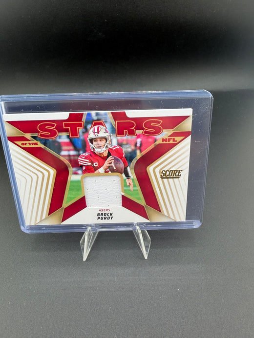 2025 Panini Score Stars of the NFL Brock Purdy Jersey Card SNJ-BPY - front
