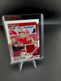 2024 Panini Donruss Threads Brock Purdy DTH-BPU San Francisco 49ers Memorabilia Card - front