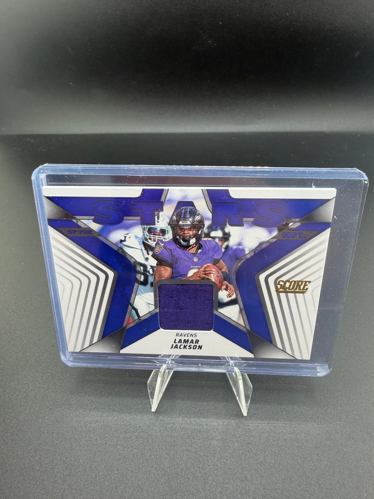 2025 Panini Score Football Score Materials Jersey Lamar Jackson SMJ-LJN - front
