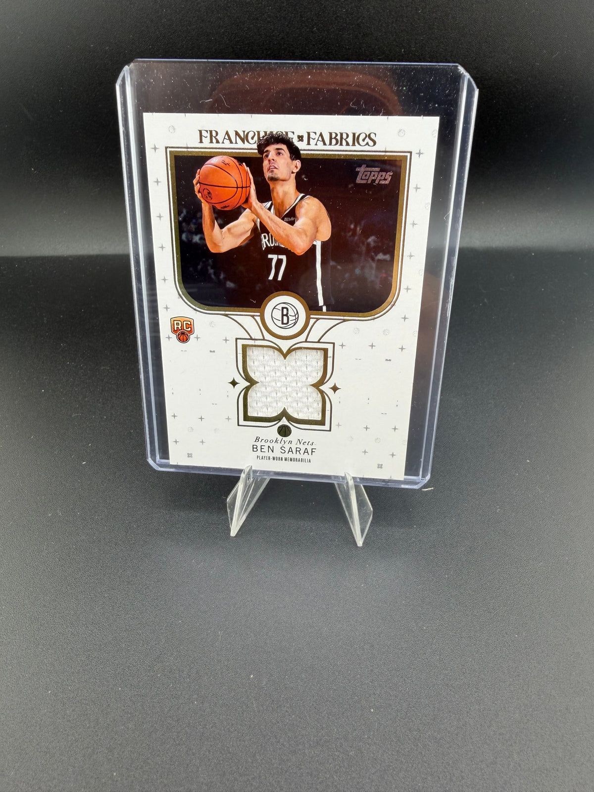 2025 Topps Franchise Fabrics Ben Saraf Brooklyn Nets Rookie Player-Worn Memorabilia Card FF-BS - front