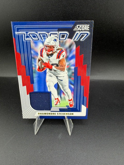 2025 Panini Score Football Zoned In Jerseys Rhamondre Stevenson #ZON-RSN - front